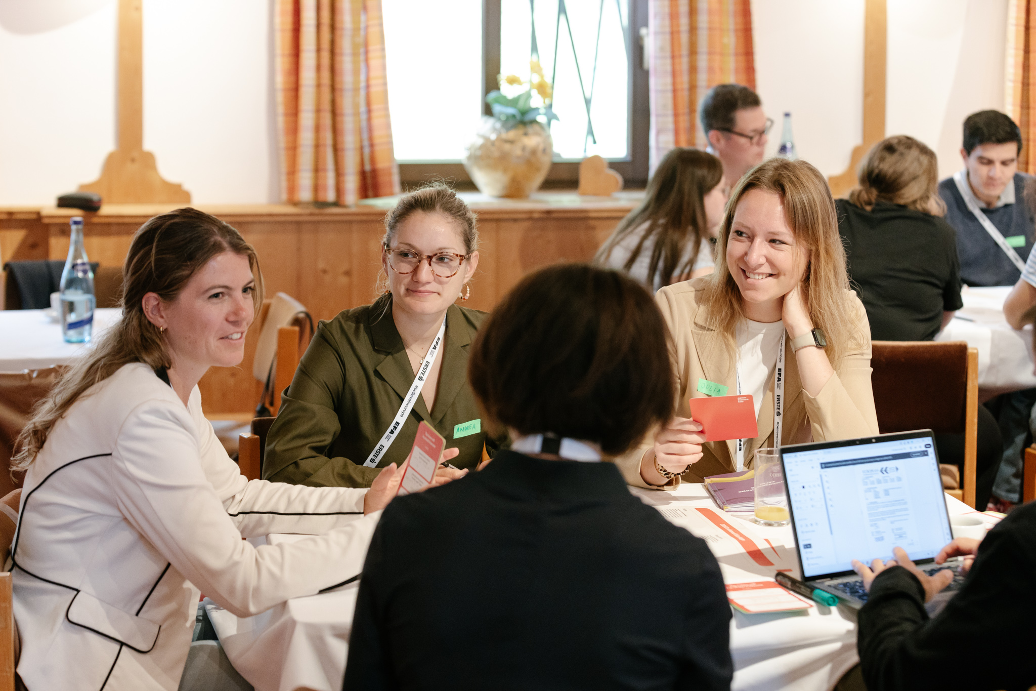 People seated around a table, participating in the workshop